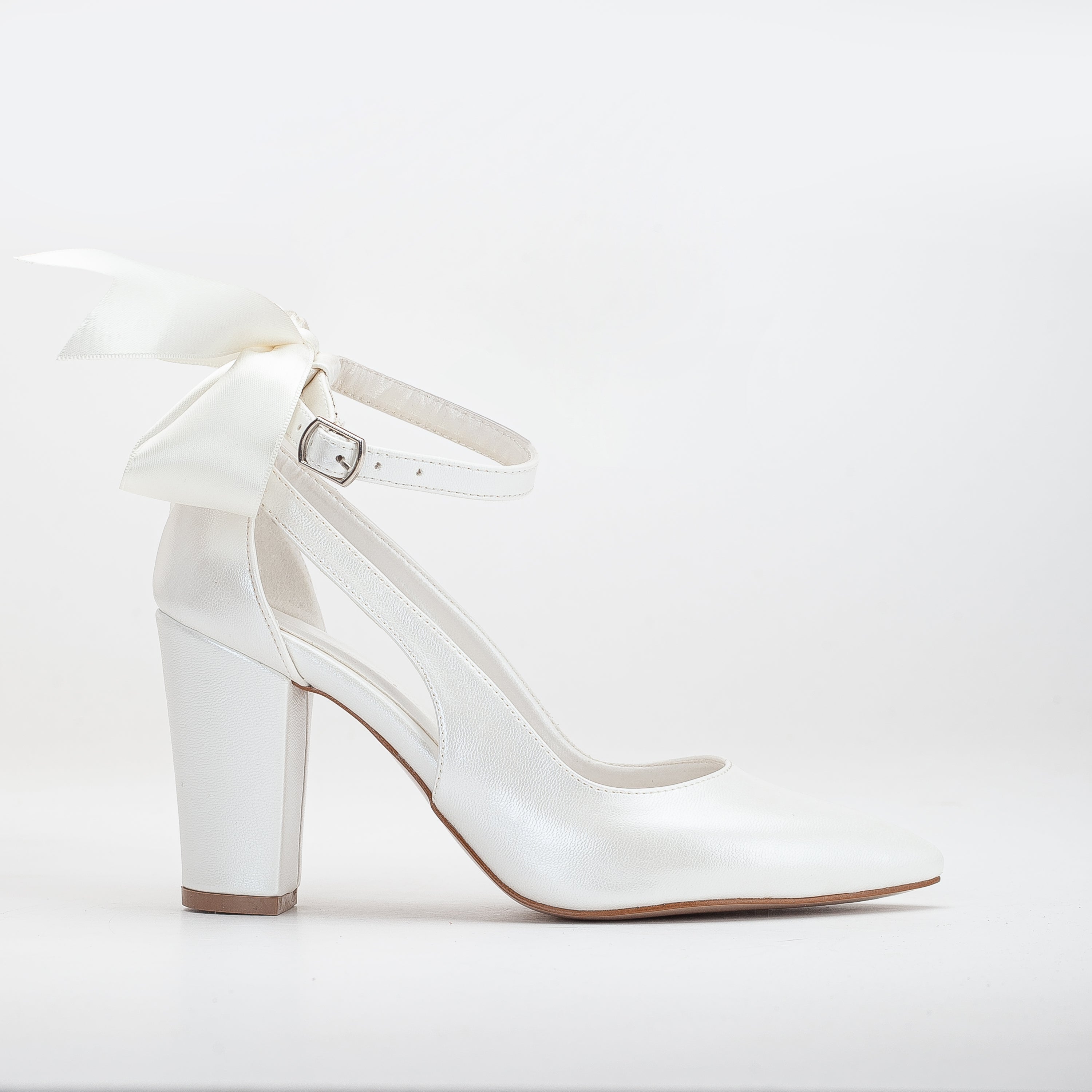 ivory vegan heels, heels with ribbon, cruelty-free footwear, eco-friendly heels, sustainable fashion, plant-based leather, ivory ribbon heels, non-leather heels, animal-free footwear, ethical fashion, vegan bridal heels, elegant ivory heels, stylish vegan heels, ribbon detail heels, ivory wedding heels, women's vegan footwear